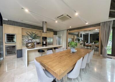 Spacious kitchen with modern appliances and large dining table