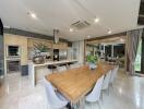 Spacious kitchen with modern appliances and large dining table