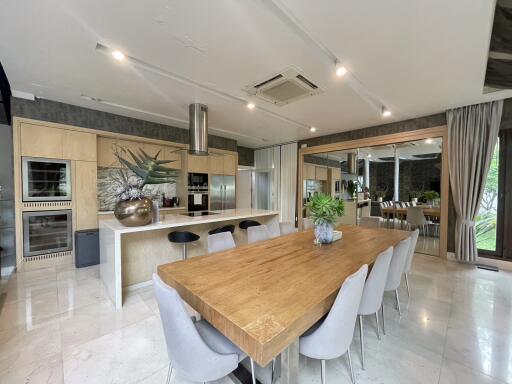 Spacious kitchen with modern appliances and large dining table