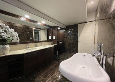 Luxurious spacious bathroom with modern fixtures and marble detailing