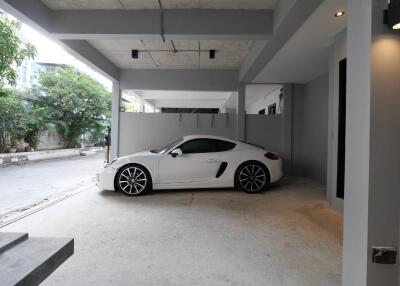 Spacious garage with a white sports car