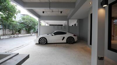 Spacious garage with a white sports car