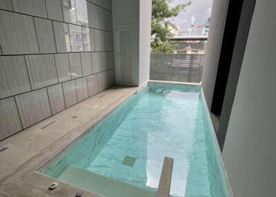 Modern residential swimming pool adjacent to the building