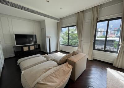 Spacious bedroom with natural light and modern decor