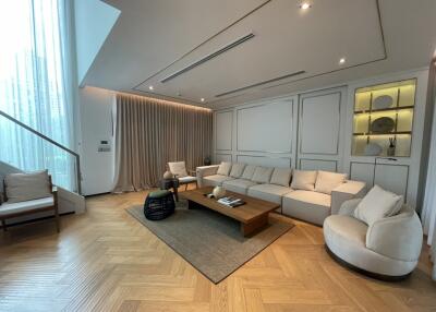Modern spacious living room with large sectional sofa and stylish decor