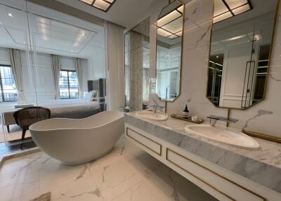 Luxurious marble bathroom with freestanding bathtub and dual sinks