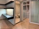 Modern bedroom with integrated bathroom and sliding glass doors