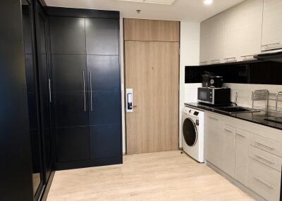 Modern kitchen with integrated appliances and wooden details