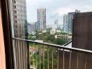 View from high-rise balcony overlooking cityscape