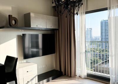 Elegant living room with large window and modern decor