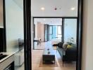 Modern apartment living room view through glass door