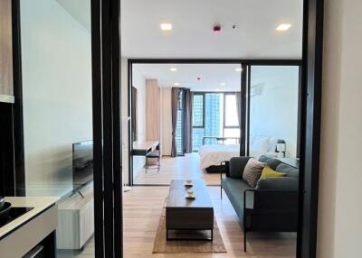 Modern apartment living room view through glass door