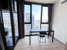 Bright and modern bedroom with city view through large windows