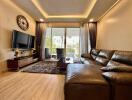 Spacious and well-lit living room with modern amenities and stylish decor