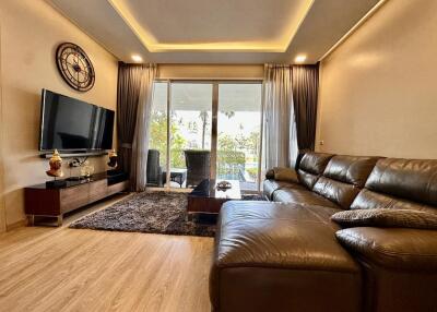 Spacious and well-lit living room with modern amenities and stylish decor