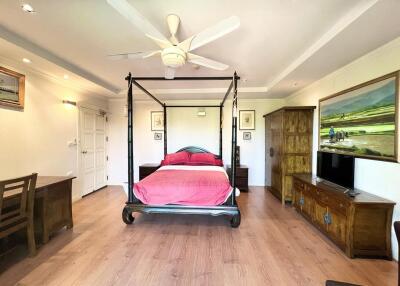 Spacious bedroom with large bed and modern amenities