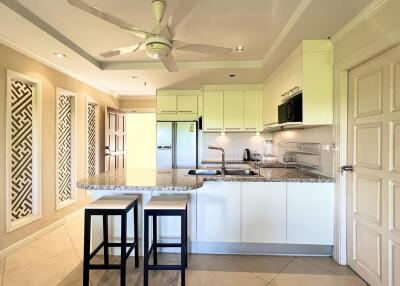 Spacious kitchen with modern appliances and breakfast bar