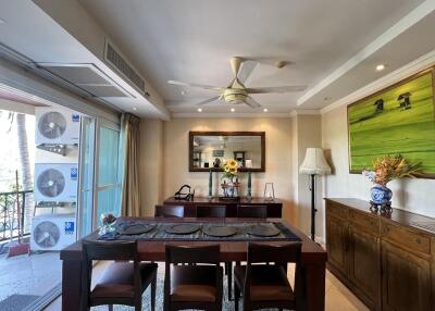 Spacious dining room with modern furnishings and balcony access