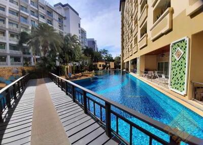 Luxurious outdoor swimming pool with surrounding apartments