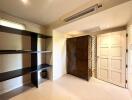 Spacious bedroom with large wardrobe and shelving unit