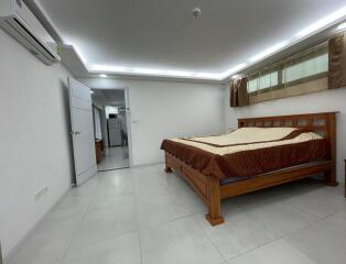 Spacious bedroom with modern design and attached bathroom