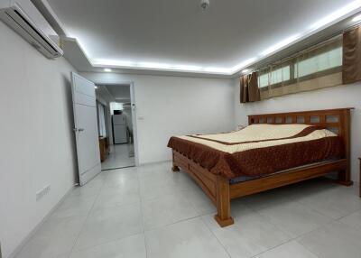 Spacious bedroom with modern design and attached bathroom