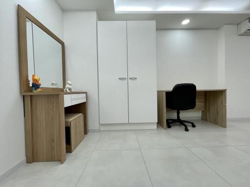Modern and clean office space with desk, chair, and storage cabinets