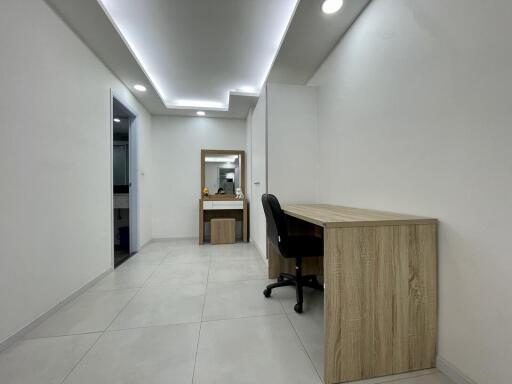 Modern home office with stylish desk and LED lighting