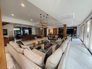 Spacious and modern open-plan living room with integrated kitchen and dining area