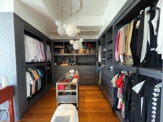Spacious walk-in closet with ample storage and elegant design