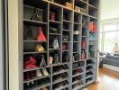 Spacious walk-in closet with organized shoe and bag storage