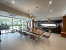 Spacious modern kitchen with integrated dining area and view of the garden