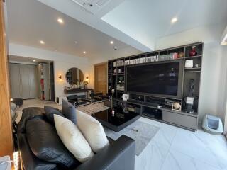 Spacious and modern living room with large entertainment unit