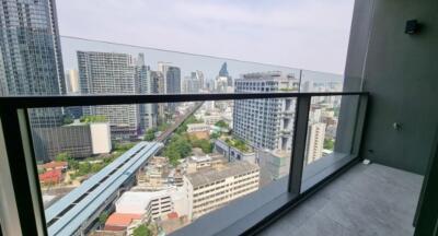 City view from high-rise apartment balcony showcasing skyscrapers and urban landscape