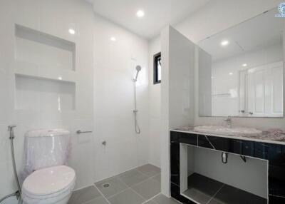 Modern bathroom with spacious shower and sleek vanity