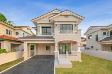 Modern two-story house with landscaped front yard and spacious driveway