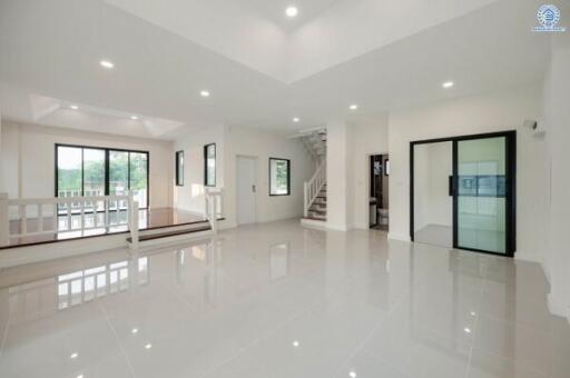 Spacious and bright living room with glossy white floor