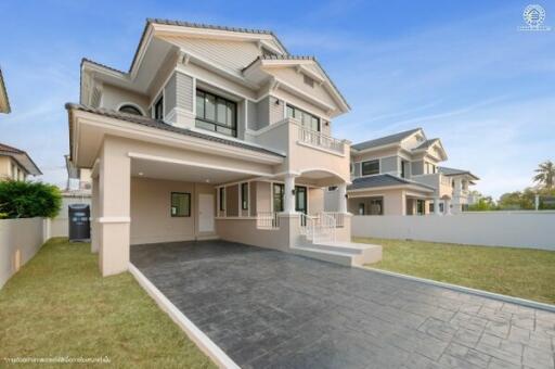 Spacious two-story residential home with large driveway and landscaped lawn