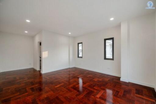 Spacious and bright living room with polished hardwood flooring