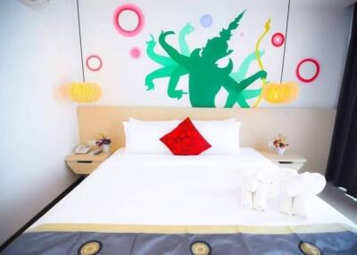 Colorfully decorated modern bedroom with artistic wall design