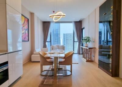 Modern apartment living room with dining area and city view