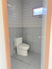 Modern bathroom with tiled walls and floors