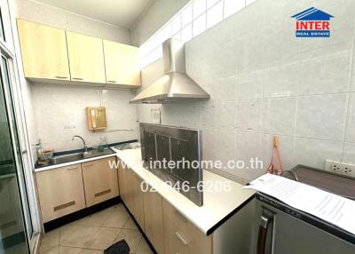 Spacious kitchen with modern appliances and ample cabinets