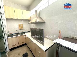 Spacious kitchen with modern appliances and ample cabinets