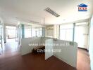 Spacious and well-lit office area with large windows and open floor plan