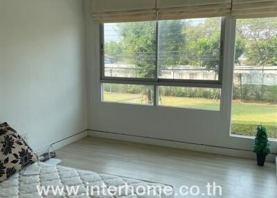 Spacious and well-lit bedroom with large window