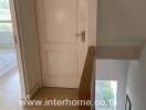 Bright interior view showing staircase and corridor in modern house