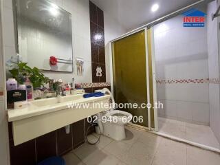 Modern bathroom with spacious sink and glass shower enclosure