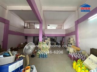 Spacious interior of a commercial building with storage items and merchandise