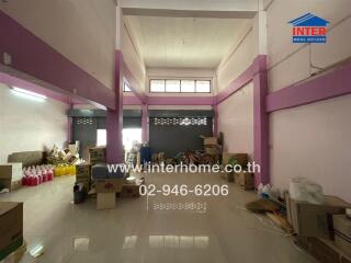 Spacious warehouse interior with storage boxes and items